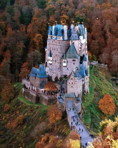 Eltz Castle is a medieval castle nestled in the hills above the Moselle river